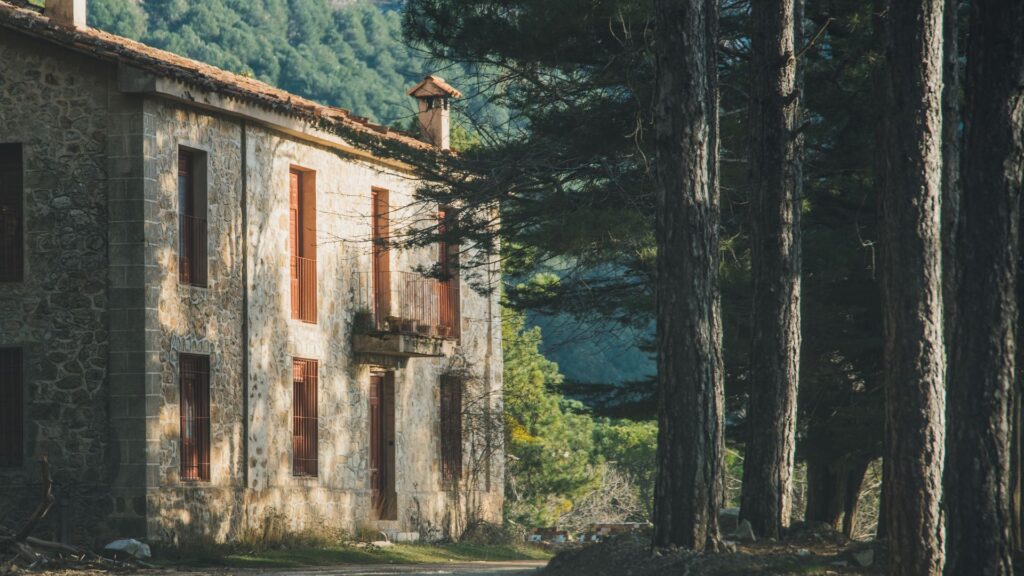 Rustic Spanish hunting estate surrounded by forest, typical for traditional montería events